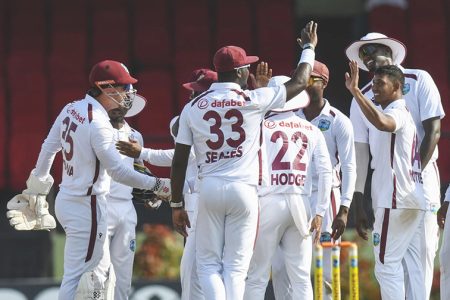 Jayden Seales (no.33) and local boy Gudakesh Motie (2nd from right) combined to snare the five wickets that fell in the South African 2nd innings
