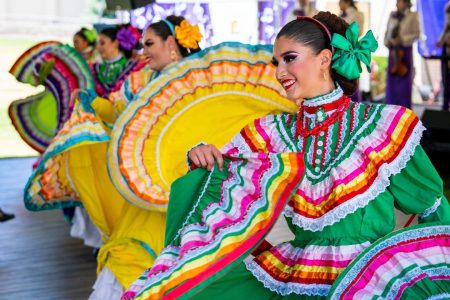 Displaying colourful Latin costumes at a previous event