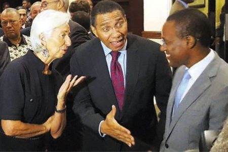 Former IMF Managing Director Christine Lagarde in conversation with Jamaican Prime Minister Andrew Holness (centre) and then Ambassador Plenipotentiary for Economic Affairs Dr Nigel Clarke (Jamaica Observer photo)