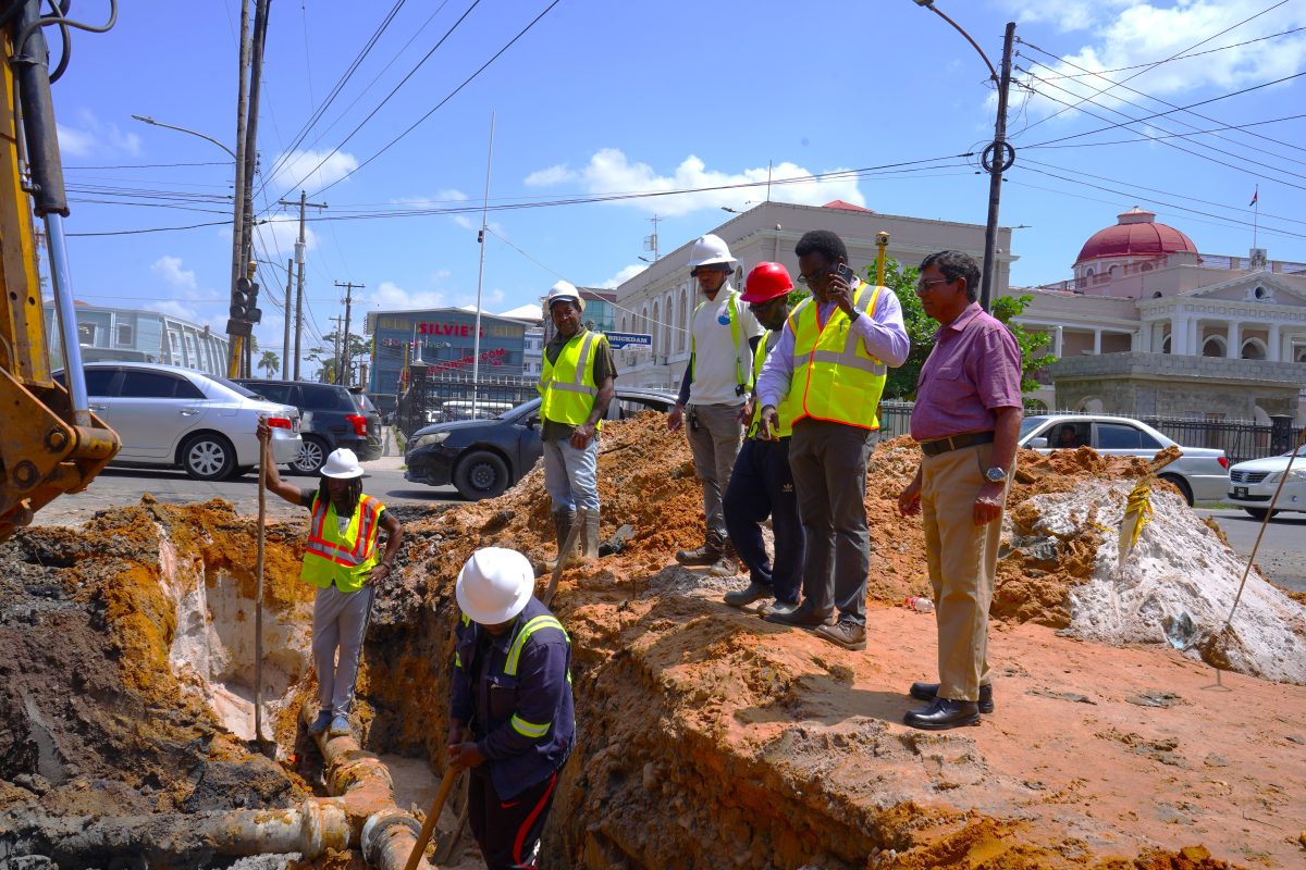 GWI Chief Executive Officer Shaik Baksh conducts inspection of ongoing repairs to a broken transmission main at the intersection of Brickdam and Avenue of the Republic.