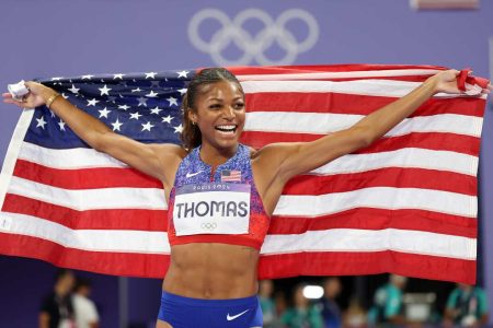 USA’s Gabby Thomas
celebrates after winning the women’s 200m Olympics crown. (Getty Images)
