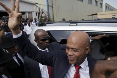 Haiti's former President Michel Martelly says goodbye after a ceremony marking the end of his presidential term, at the Haitian Parliament in Port-au-Prince, Haiti, February 7, 2016. REUTERS/Andres Martinez Casares/File Photo