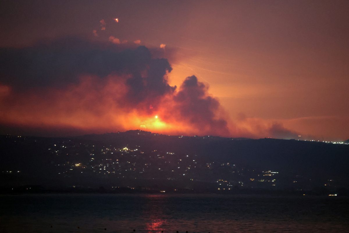 A view shows smoke and fire on the Lebanese side of the border with Israel, after Israel said it had noted armed group Hezbollah preparing to attack Israel and had carried out pre-emptive strikes on Hezbollah targets in Lebanon, as seen from Tyre, southern Lebanon August 25, 2024. REUTERS/Aziz Taher