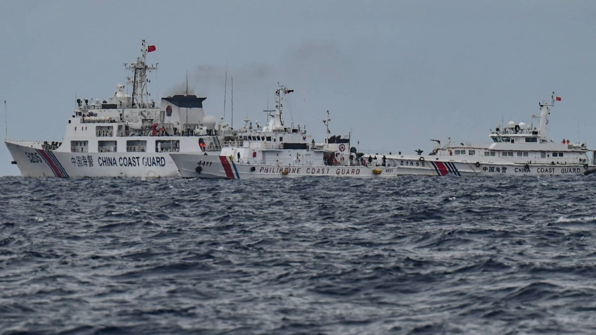 China Coast Guard ships (background L and R) are seen past the Philippine Coast Guard ship BRP Cape Engano (C), as photographed from the BRP Cabra during a supply mission to Sabina Shoal in disputed waters of the South China Sea on Aug. 26, 2024.
Jam Sta Rosajam Sta Rosa | AFP | Getty Image