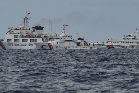 China Coast Guard ships (background L and R) are seen past the Philippine Coast Guard ship BRP Cape Engano (C), as photographed from the BRP Cabra during a supply mission to Sabina Shoal in disputed waters of the South China Sea on Aug. 26, 2024.
Jam Sta Rosajam Sta Rosa | AFP | Getty Image