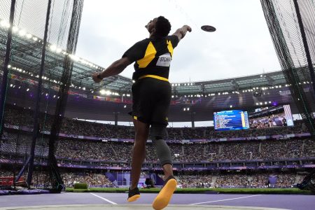 Jamaica’s Roje Stona launches to an Olympic record to win the men’s discus throw crown (World Athletics Photo)