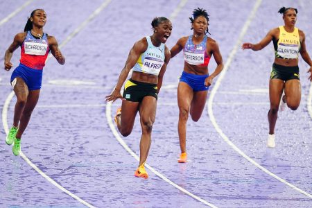 Momentous! Julien Alfred (centre) of St Lucia storms to victory to win the women’s 100m gold at the Paris Olympics, relegating favourite American Sha’Carri Richardson (left) to second place 