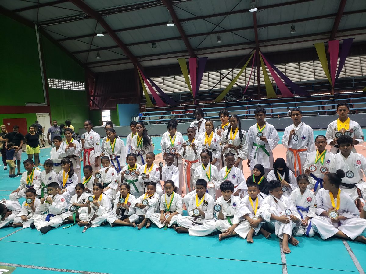 Participants at the Guyana Karate Federation’s (GKF) National Junior Championship display their respective spoils at the National Gymnasium on Mandela Avenue.