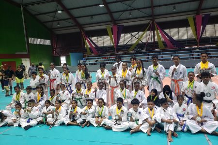 Participants at the Guyana Karate Federation’s (GKF) National Junior Championship display their respective spoils at the National Gymnasium on Mandela Avenue.