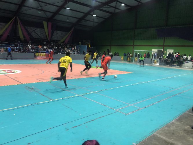 Part of the action in the ‘Keep Ya Five Alive’ Futsal Championship between North Ruimveldt (orange)  and Bent Street (yellow)