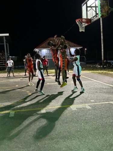 A scene from the final between Block 22 Flames (white) and Victory Valley Royals
