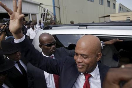 Haiti’s former President Michel Martelly says goodbye after a ceremony marking the end of his presidential term, at the Haitian Parliament in Port-au-Prince, Haiti, February 7, 2016.