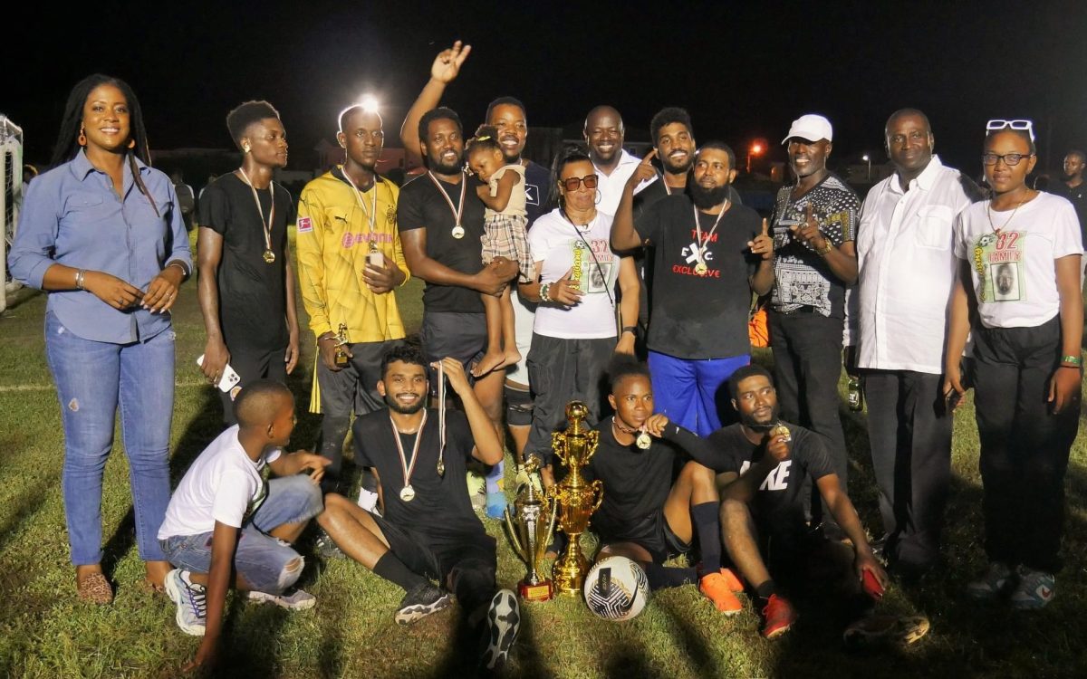 The victorious Panthers unit poses with their spoils after winning the Plaisance Inter-Block 7-Aside Football Championship