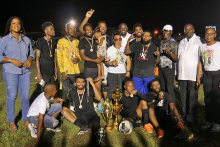 The victorious Panthers unit poses with their spoils after winning the Plaisance Inter-Block 7-Aside Football Championship