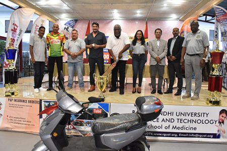 Prime Minister Mark Phillips (centre) poses with officials and sponsors at the launch of the Prime Minister Softball Cup