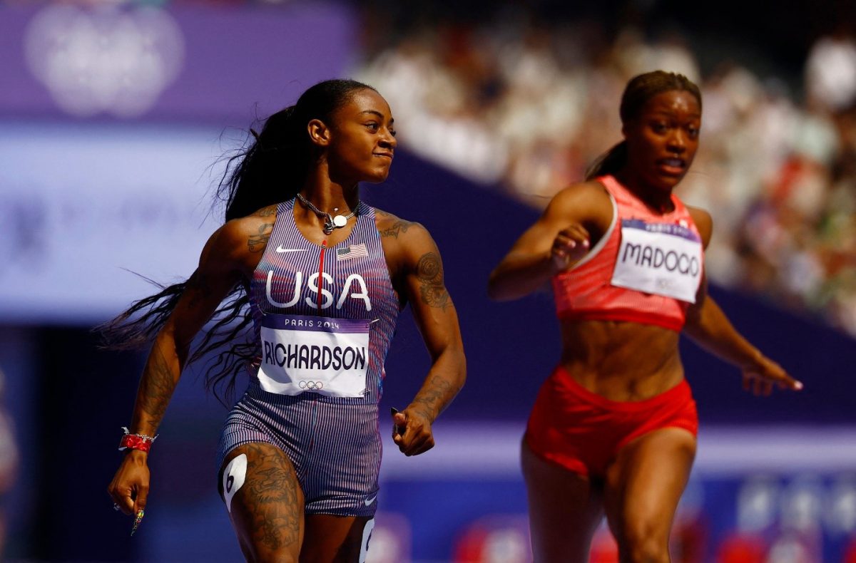 Sha’Carri Richardson (left) of United States wins heat 1. REUTERS/Sarah Meyssonnier 