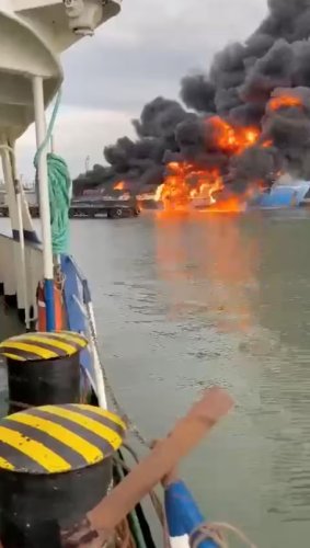 Smoke and flames rise from a ferry following a fire at the port of Kavkaz, in the course of Russia-Ukraine conflict, as seen from Chushka, Krasnodar region, Russia, August 22, 2024, in this screengrab taken from a social media video.