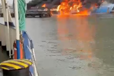 Smoke and flames rise from a ferry following a fire at the port of Kavkaz, in the course of Russia-Ukraine conflict, as seen from Chushka, Krasnodar region, Russia, August 22, 2024, in this screengrab taken from a social media video.