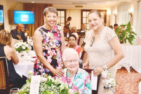 Reunion Committee members Donna Thomson (Burgan) (left) and Marilyn Farnum (Thijs) flank Thecla Perreira, the oldest former player to attend the reunion (Photo courtesy of the Guyana Women's Field Hockey Reunion 2024) 