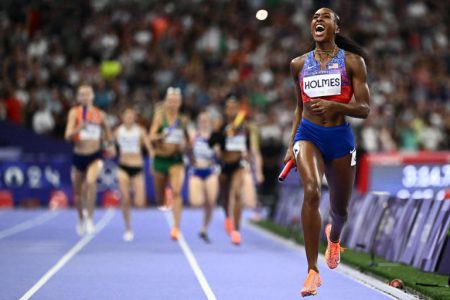 Unchallenged! Alexis Holmes of the USA crosses the finish line unchallenged to seal the women’s 4x400m crown