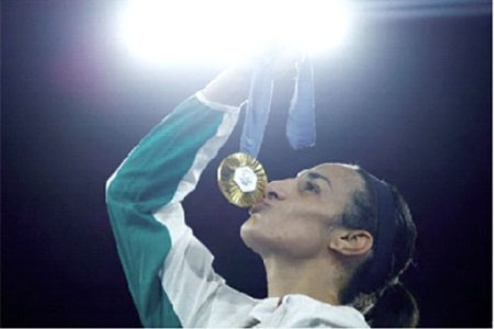 Gold medallist Imane Khelif of Algeria kisses her medal. REUTERS/Peter Cziborra/File Photo 