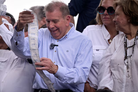 Opposition candidate Edmundo Gonzalez holds electoral records as people gather to protest after election results awarded Venezuela’s President Nicolas Maduro with a third term, in Caracas, Venezuela July 30, 2024