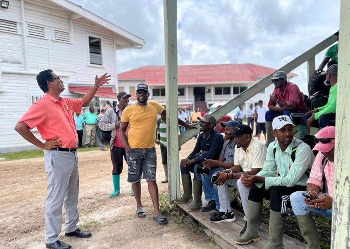 Paul Cheong (left) addressing harvesters