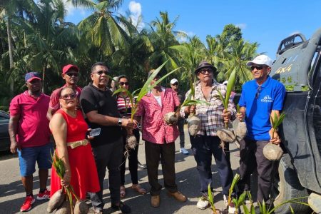 Minister of Agriculture Zulfikar Mustapha (fourth from left) handing over farming inputs in the East Bank Berbice area. 