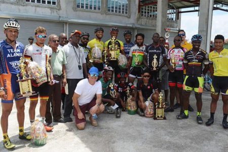 The overall category winners of a
previous Regan Rodrigues Memorial Cycling Road Race pose for a photo.
