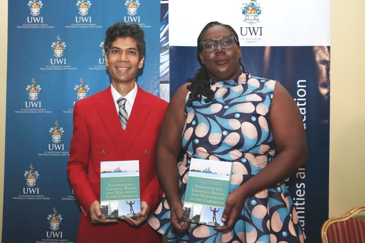 Dr. Jerome Teelucksingh and Dr. Allison Ramsay, historians and co-editors of The UWI St. Augustine History Department’s newest publication ‘Independence, Colonial Relics and Monuments in the Caribbean’, proudly display copies of the book. [Image courtesy The UWI]
