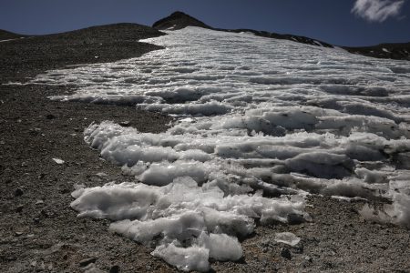 A view shows the Iver glacier close to the El Plomo mountain summit, in the Andes mountain range, in the Santiago Metropolitan Region, Chile, April 4, 2024. On a clear day, Chile's towering 5,400-meter El Plomo mountain can be seen from the capital, Santiago. The glacier-capped Andean peak has been climbed and revered for centuries, with the Incas carrying out human sacrifices at the summit. Now the mountain is crumbling. Rising global temperatures due to climate change have led the glacier to retreat and the permafrost to melt. New lagoons have formed and ruptured, landslides have injured climbers and massive sinkholes have opened up, breaking up the ancient path to the summit.       REUTERS/Ivan Alvarado