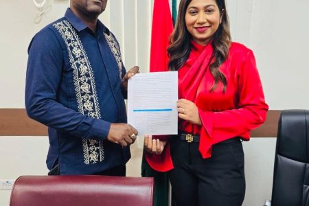  The Ministry of Education and the Guyana Teachers Union (GTU) yesterday inked a three-year agreement that will see teachers receiving up to 10% increase on their salaries coupled with a number of non-salary benefits. GTU President Mark Lyte and Permanent Secretary of the Ministry of Education Shanielle Hossein-Outar are seen with the signed agreements. (Ministry of Education photo)
