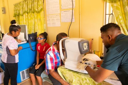 A team from the Ministry of Health yesterday visited the Monkey Mountain Village, (Potaro-Siparuni), where scores of residents turned out for eye testing and cervical cancer screening services. Senior citizens and children received $2,000 vouchers for eye testing, with an additional $15,000 voucher available if they need spectacles.
Women between 21- 65 years of age received vouchers valued at $8000 which covers the cost of screening for cervical cancer.  Additionally, dental care services were also provided.  (Ministry of Health photo)
