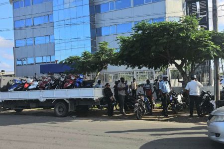 Yesterday, Inspector Alder and ranks from Traffic Headquarters carried out a motorcycle campaign on the Turkeyen Railway Embankment, East Coast Demerara, and 25 cases were made. Eight of these were for failure to wear a helmet. (Police photo)
