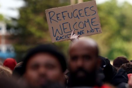 People gather against an an anti-immigration protest, in Liverpool , Britain, August 7, 2024. REUTERS/Yves Herman