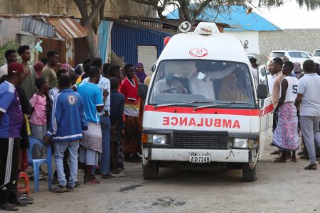 People gather as an ambulance carries the body of an unidentified woman killed in an explosion that occurred while revellers were swimming at the Lido beach in Mogadishu, Somalia August 3, 2024. REUTERS/Feisal Omar