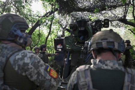 Ukraine servicemen prepare a Caesar self-propelled howitzer to fire towards Russian troops, outside the town of Pokrovsk, amid Russia's attack on Ukraine, in Donetsk region, Ukraine August 13, 2024. REUTERS/Stringer