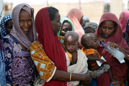 Women wait with their children under a shed for food rations at a internally displaced persons (IDP) camp on the outskirts of Maiduguri, northeast Nigeria June 6, 2017. REUTERS/Akintunde Akinleye/File Photo