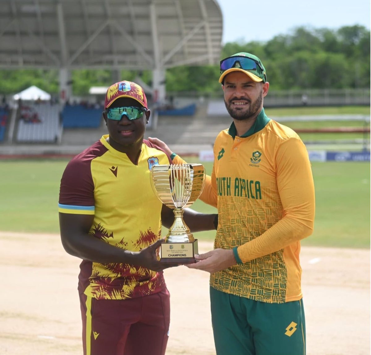 West Indies captain Rovman Powell (left) and South Africa’s captain Aiden Markram with the trophy (Windies Cricket photo)