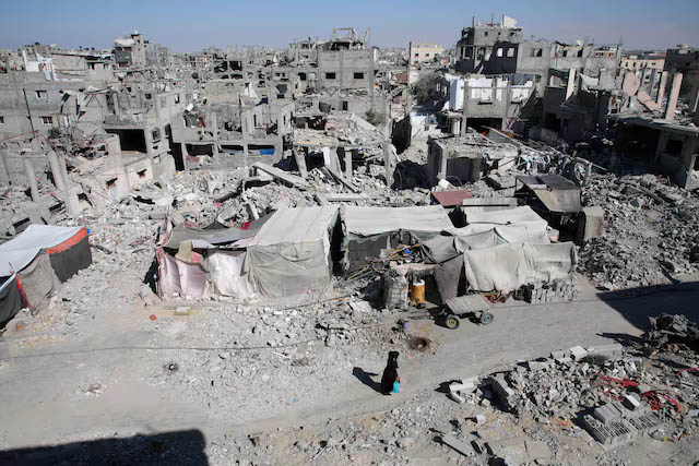 A Palestinian walks past the rubble of houses destroyed by Israeli strikes, amid Israel-Hamas conflict, in Khan Younis in the southern Gaza Strip, September 4, 2024.