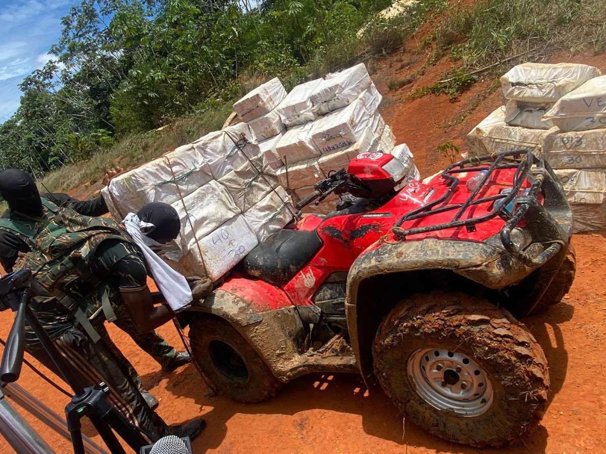 Transported: A GDF rank is seen with the cocaine shortly after it was transported by an ATV (Shuntel Glasgow photo)