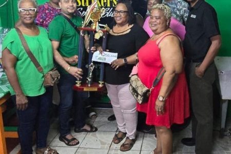 Big Girls receiving their first place package after winning the 16th Anniversary All-Female Domino Championship