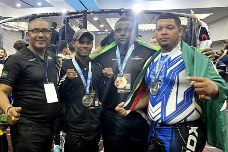 The trio (2nd from left) of Ezekiel Persaud, John Campayne, and Lyndon Fung captured medals at the Pan Am MMA Championship in Mexico
