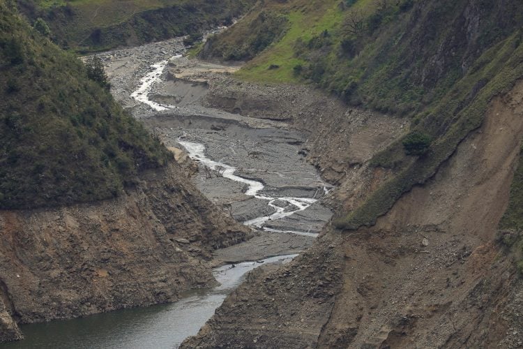 FILE PHOTO: A view shows a small stream that feeds the Paute river, affected by a severe drought, in Paute, Ecuador September 17, 2024. REUTERS/Karen Toro/File Photo