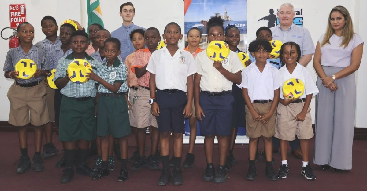 Representatives from the competing teams display their
respective balls at the conclusion of the distribution exercise.