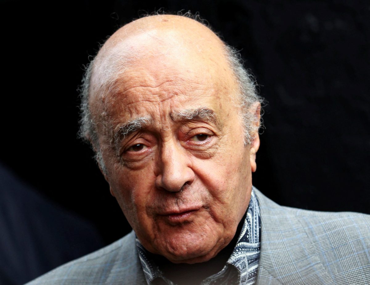 FILE PHOTO: Fulham’s chairman Mohamed Al Fayed listens as Fulham’s new manager Mark Hughes speaks during a news conference at Craven Cottage stadium in London August 3, 2010. REUTERS/Luke MacGregor/File Photo