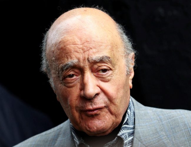 FILE PHOTO: Fulham's chairman Mohamed Al Fayed listens as Fulham's new manager Mark Hughes speaks during a news conference at Craven Cottage stadium in London August 3, 2010. REUTERS/Luke MacGregor/File Photo