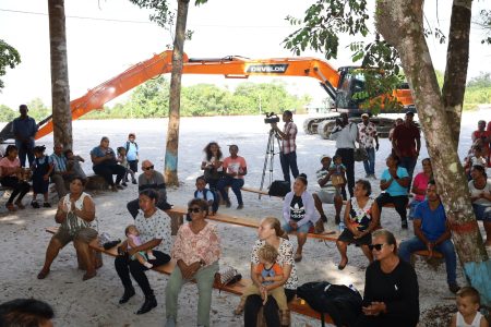 Minister of Agriculture, Zulfikar Mustapha and team yesterday commissioned and handed over a new extra-long boom excavator (in the background) to Bethany Village in Region Two. A release from the Ministry said that this excavator will remain in the village permanently.  (Ministry of Agriculture photo)
