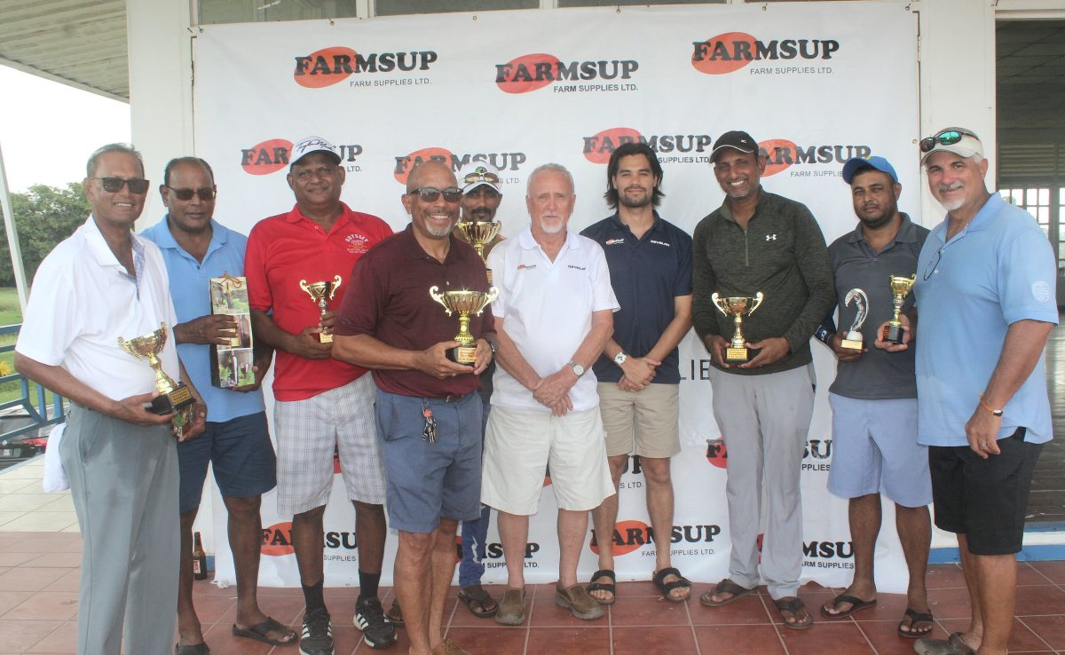 The winners at the Farmsup Golf tournament posed for a photo with their trophies and prizes.