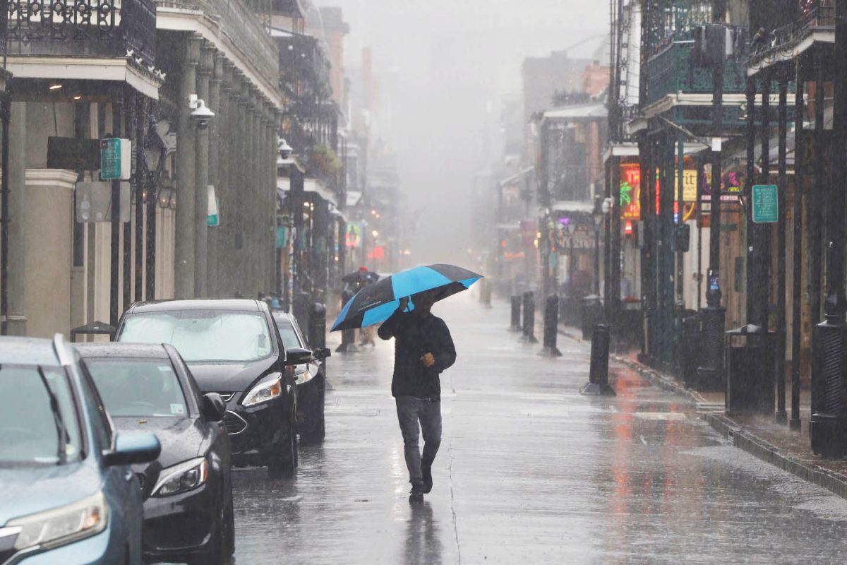 A pedestrian walks down Bourbon Street as the effects of Hurricane Francine begin to be felt in New Orleans, Louisiana, U.S. September 11, 2024. REUTERS/Edmund D. Fountain